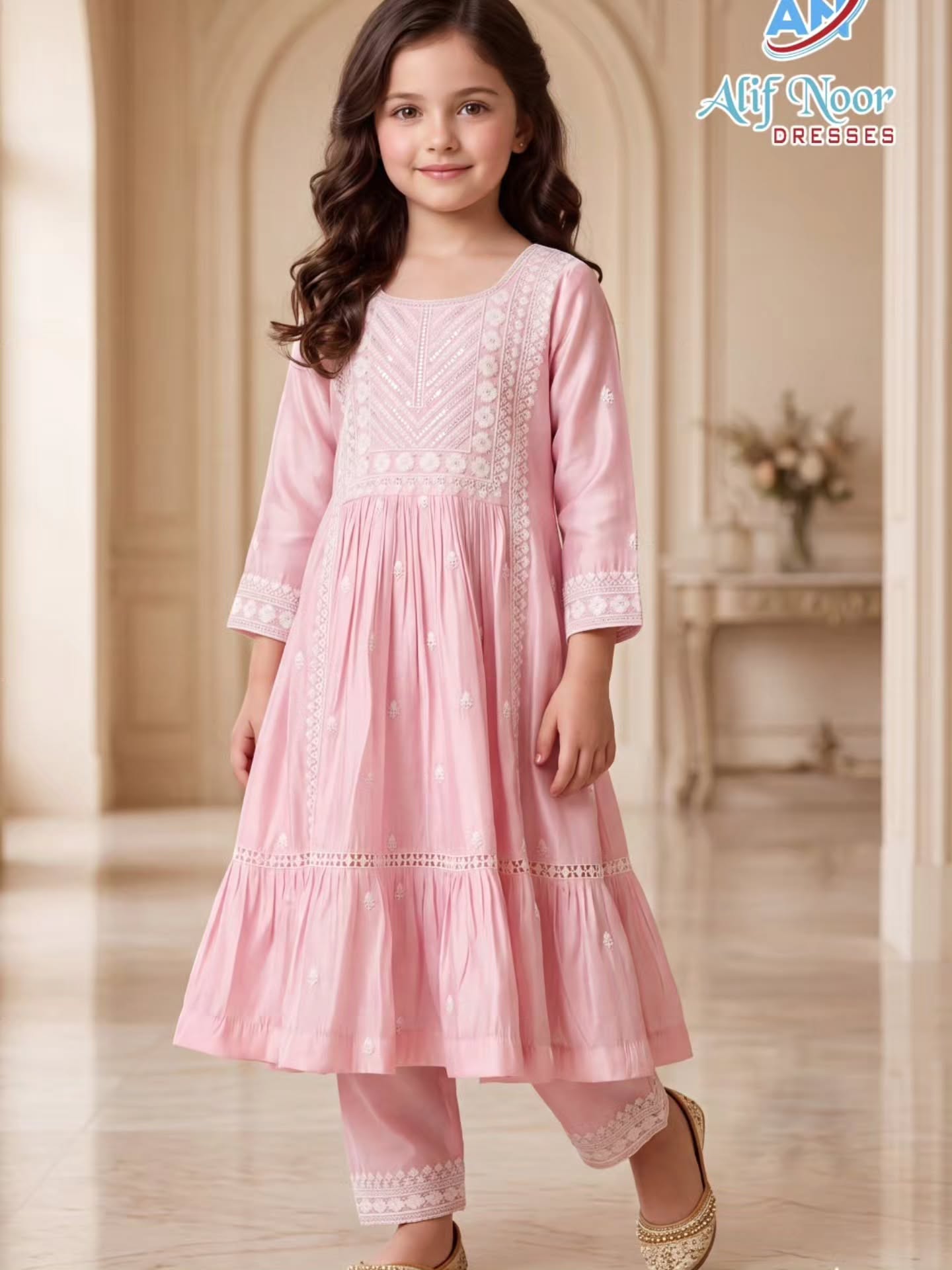 Girl wearing a blush pink embroidered anarkali set from Alif Noor Dresses